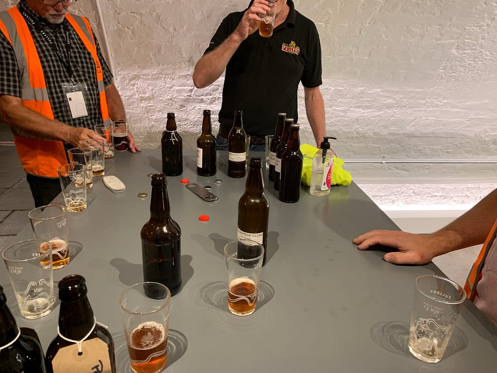 Fuller's Head Brewer, Guy Stewart, sampling the Anglian Craft Brewer's clone beers of London Pride in the Hock Cellar after a Fuller's guided tour.
